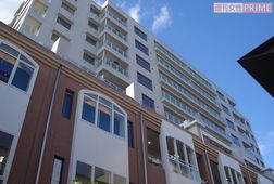 商店街の上部にはマンションが建設されている。今後も増築される予定