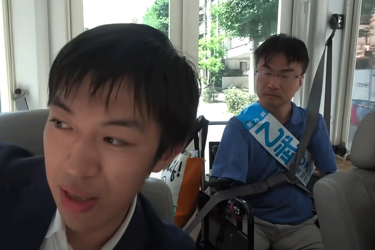 乙武選挙カーで都心を走る「スーツ」（※Youtubeチャンネル「スーツ交通」より）