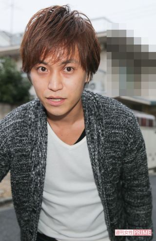 '14年10月、直撃取材をうける梅田賢三