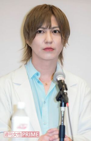 会見で勝訴を報告した新澤典将さん