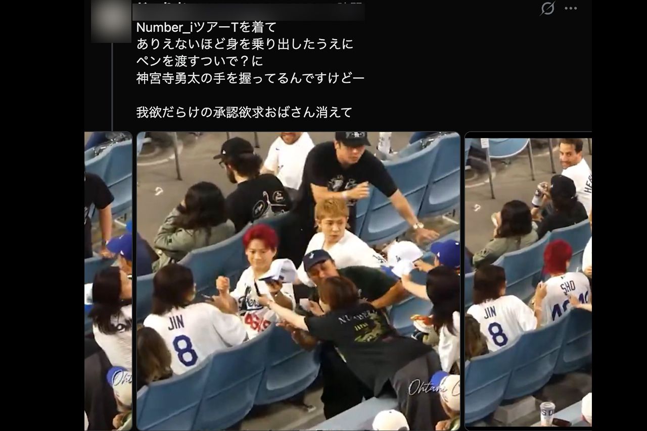 number_iからサインをもらうために身を乗り出すファン（拡散されたXより、編集部一部加工）